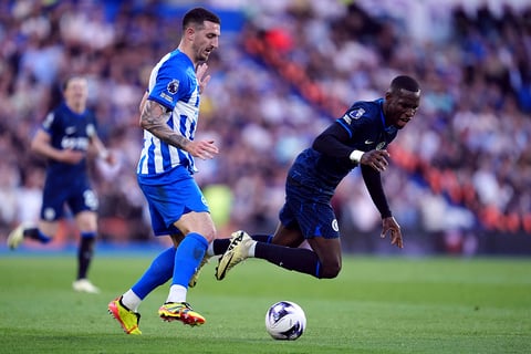 Nicolas Jackson and Lewis Dunk challenge for the ball